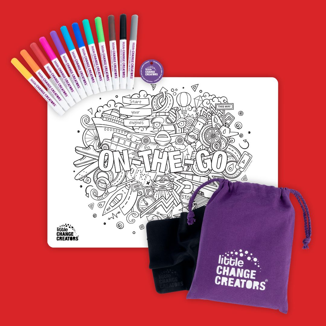 A white silicone colouring mat with black line art featuring a plane, cruise ship, skateboard, car, train and many elements related to transportation. The words 'On-The-Go' are featured across the centre. The set comes with a purple storage bag with a Little Change Creators logo.