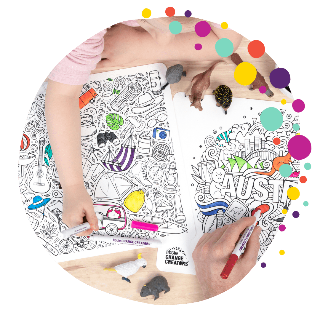 Child and adult using silicone colouring mat sets on a table