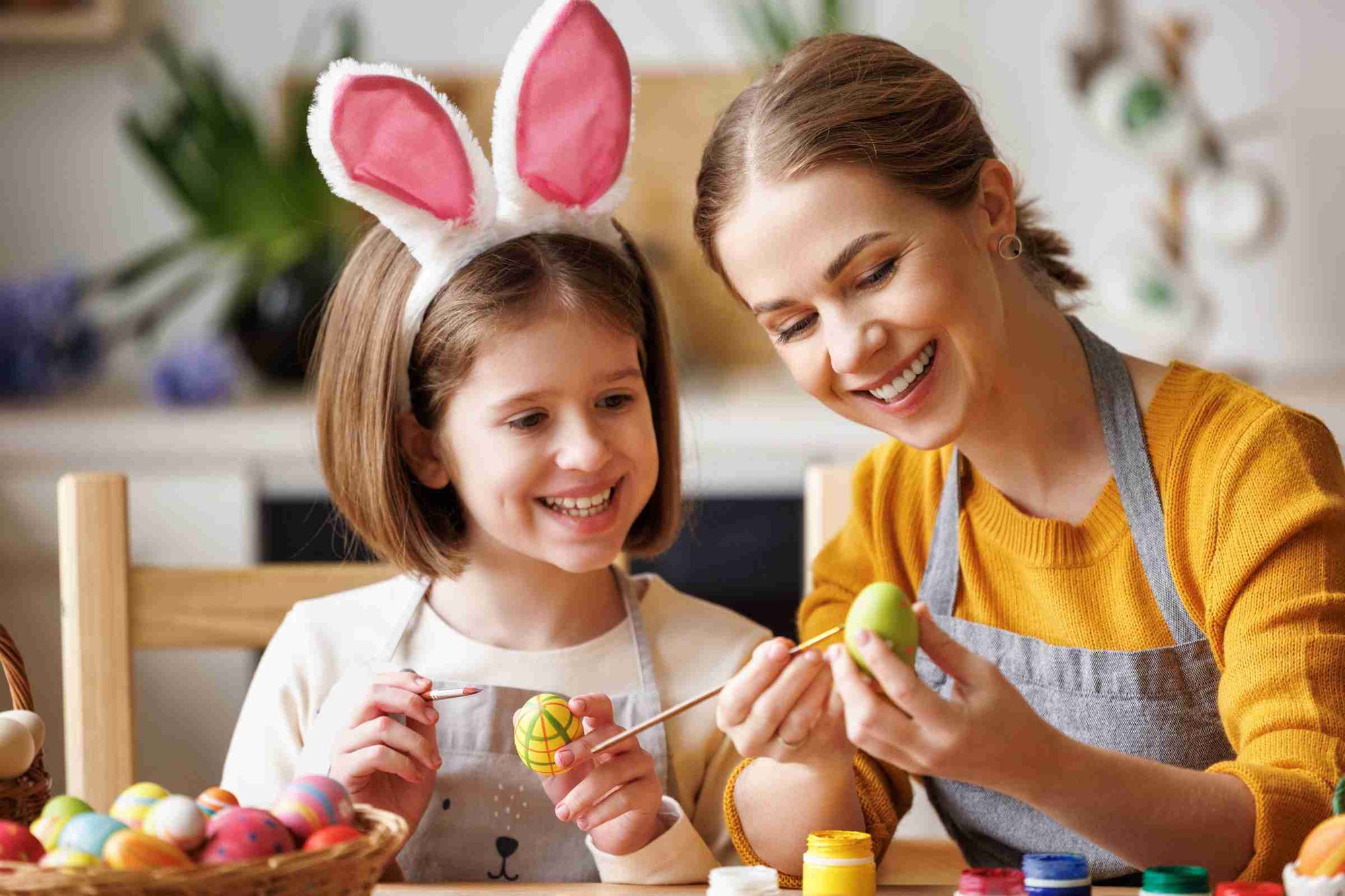 A mother teaches Easter Crafts to her child