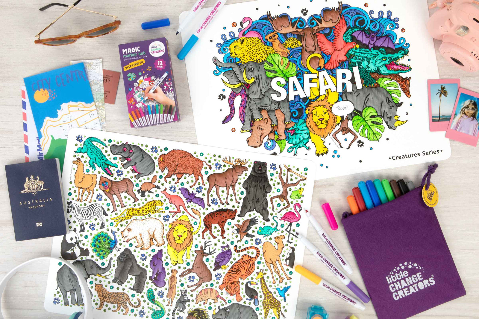 Wipeable silicone colouring sheets with animals surrounded by travel-related items such as maps, a passport and a camera.