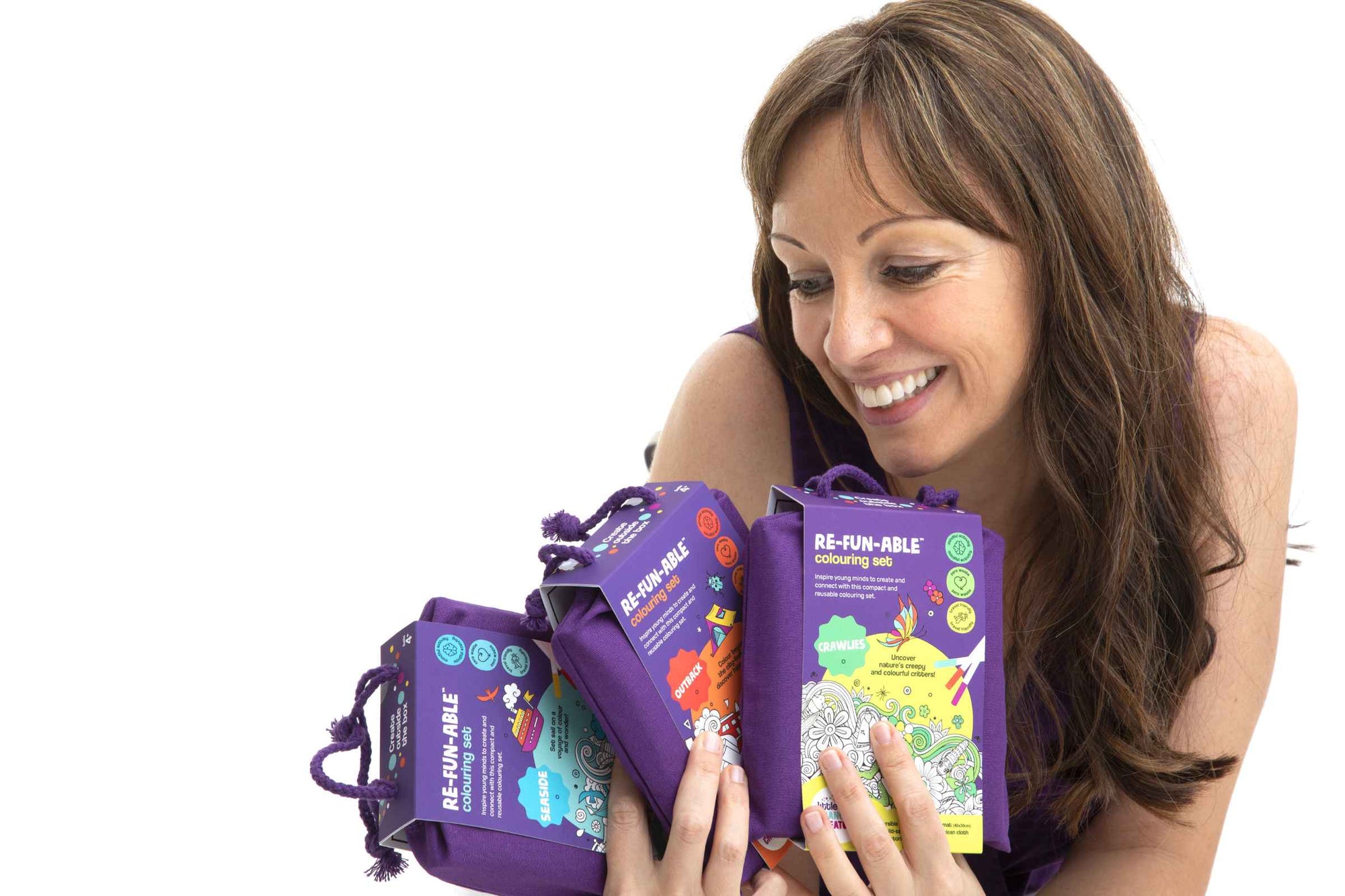 Little Change Creators founder, Paige McInnes, smiles as she looks at her award-winning creative play products.