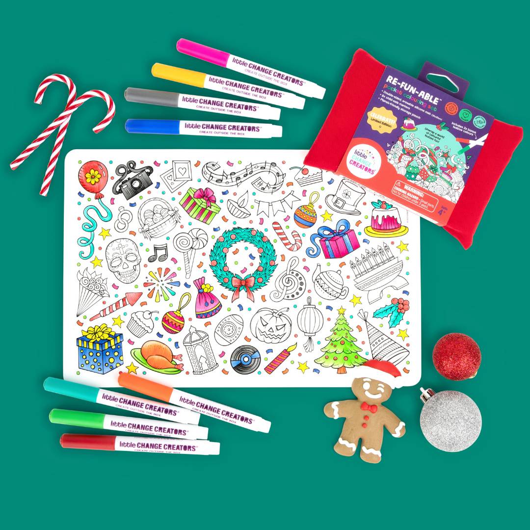 Christmas-themed colouring activity kit with markers and Christmas decorations on a green background.