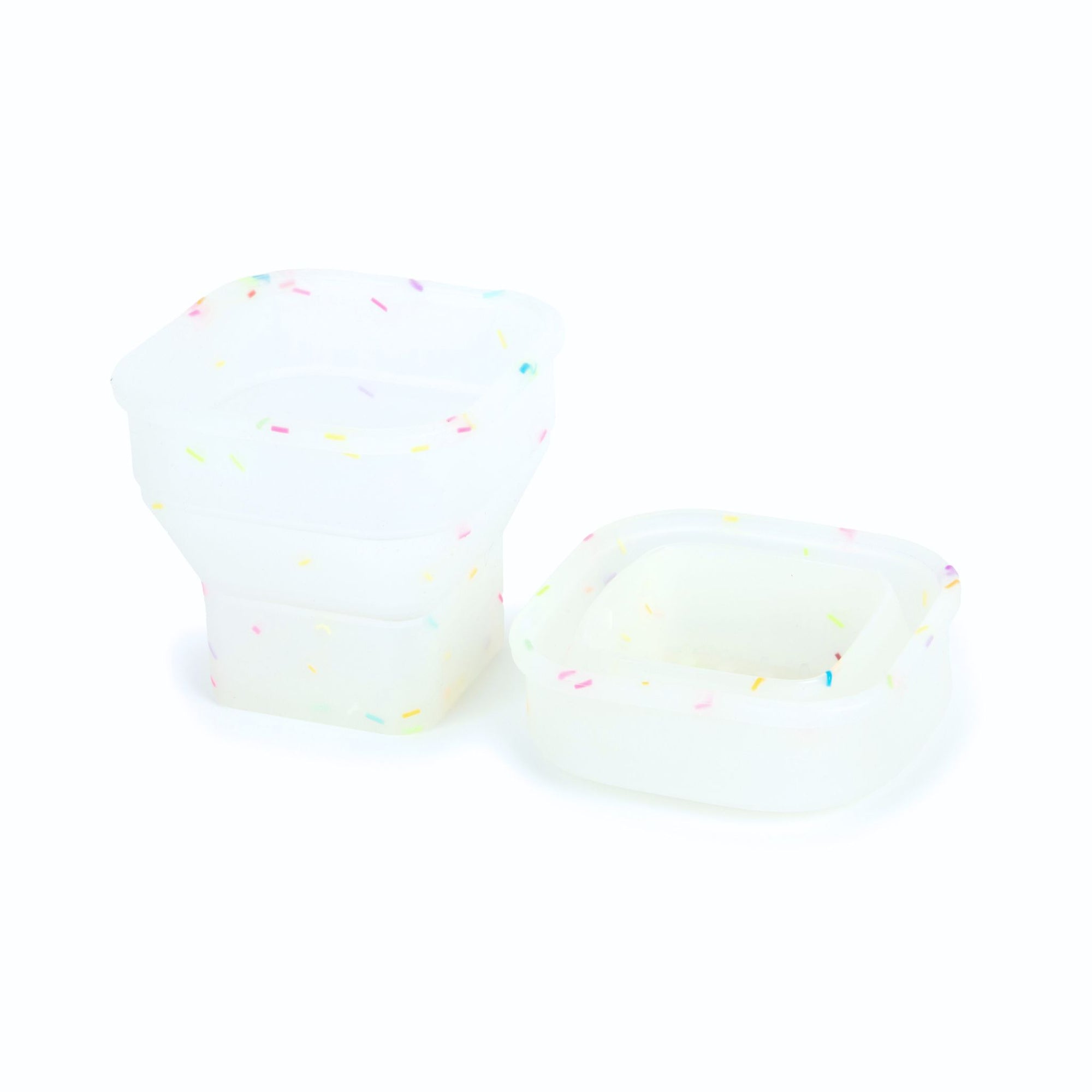 A foldable silicone cup in a white colour with multi-coloured sprinkles.