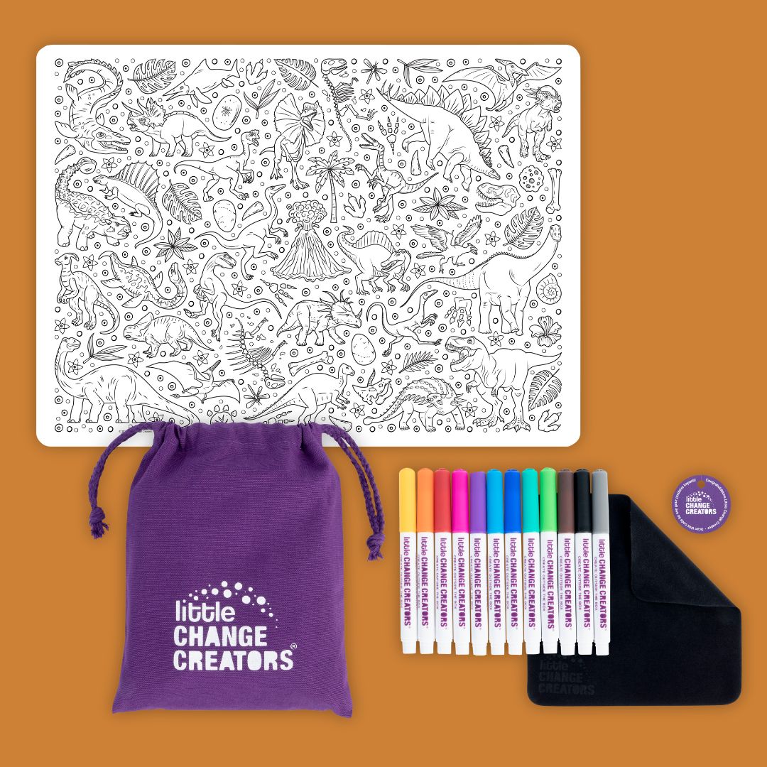 A dinosaur colouring activity mat with rainbow-coloured markers and a purple carry bag.