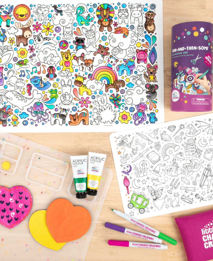 Reusable silicone activity mats and craft mat with children's art supplies on a wooden background.
