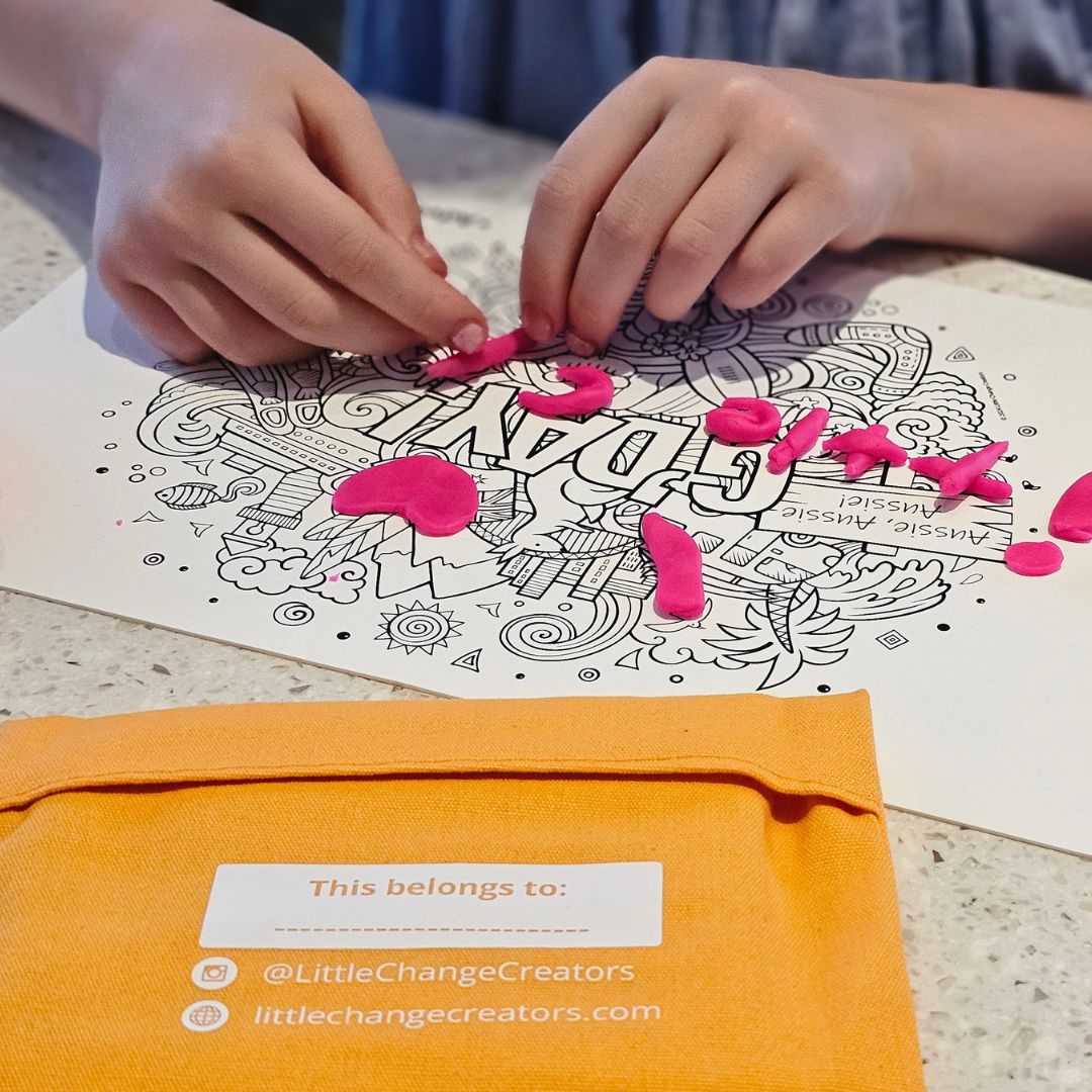 Image shows a silicone activity mat being used with playdough.