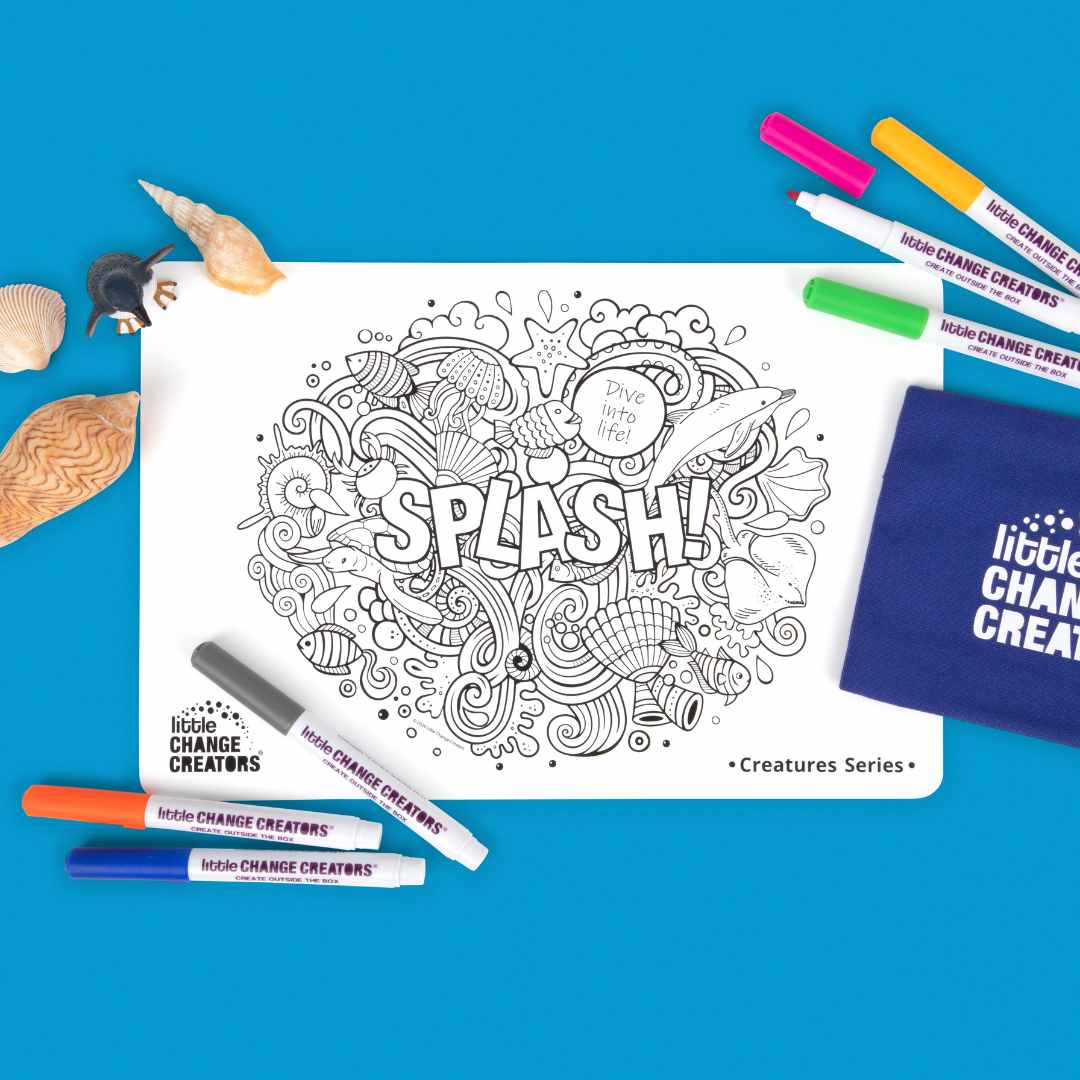 Silicone colouring mat with sea creatures and markers on a blue background, featuring 'Little Change Creators' branding.