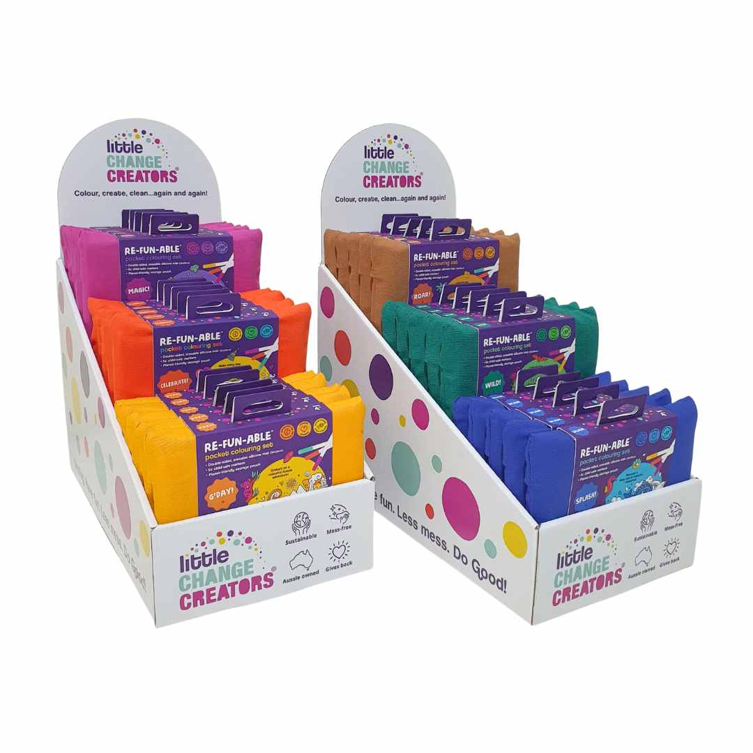 Point of Sale display of colouring sets with 'Little Change Creators' branding on a white background.